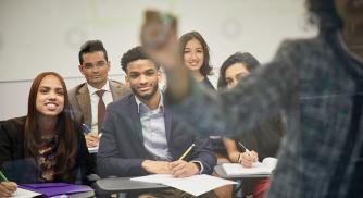 A class of students paying attention to the teacher